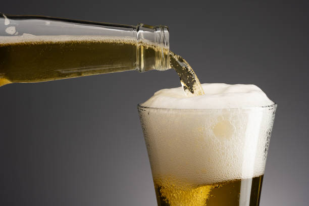 istock Glass of beer with foam on dark background 1778671762