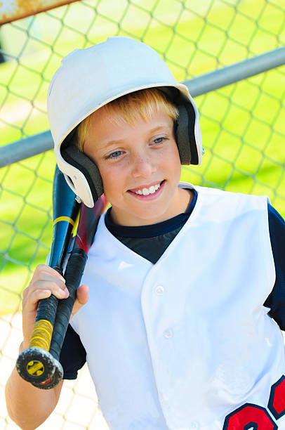 istock Cute baseball player in dugout 177867289