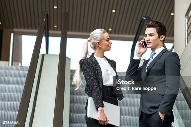 Business Colleagues On Escalator Stock Photo - Download Image Now - Adult, Black Color, Business