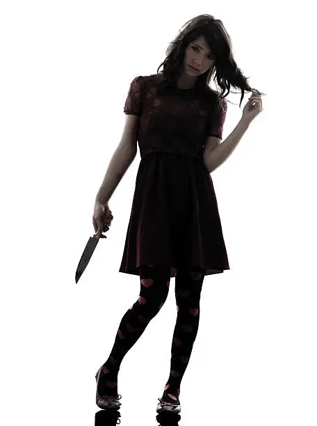 Photo of strange young woman killer holding bloody knife silhouette