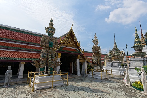 Bangkok, Thailand: 14 October 2022: Wat Phra Kaew, commonly known in English as the Temple of the Emerald Buddha, is regarded as the most sacred Buddhist temple (wat) in Thailand.