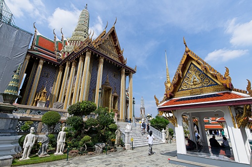 Bangkok, Thailand: 14 October 2022: Wat Phra Kaew, commonly known in English as the Temple of the Emerald Buddha, is regarded as the most sacred Buddhist temple (wat) in Thailand.