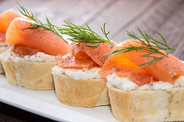 istock Baguette with Salmon on wood 177868939