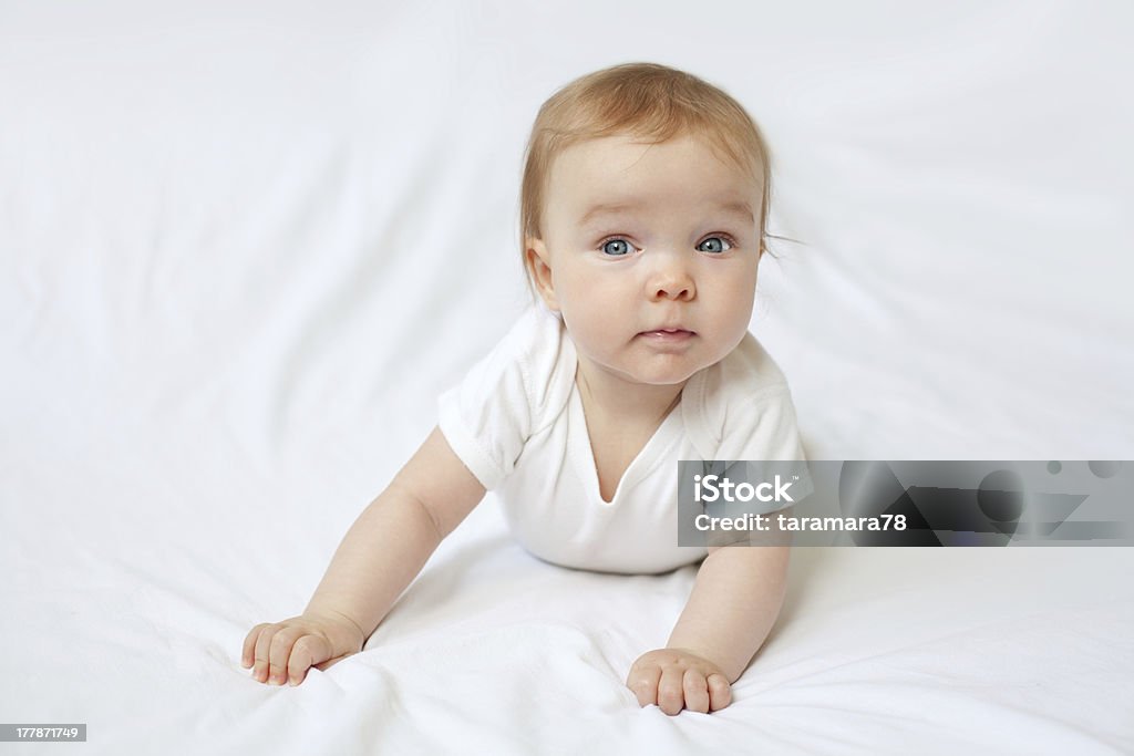 Baby Beautiful baby girl on the bed. 0-11 Months Stock Photo
