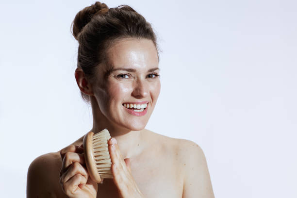 istock happy young female with massager on white 1778720456