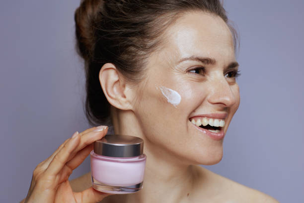 istock smiling modern woman with cosmetic cream jar 1778720468