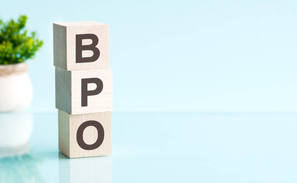 istock BPO - text on wooden cubes on blue background. business concept. 1778721007