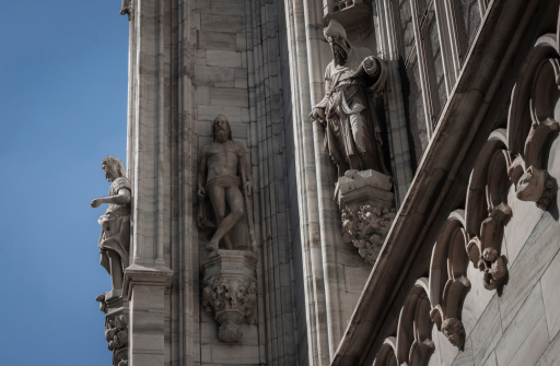 White marble statues on the facade of a church
