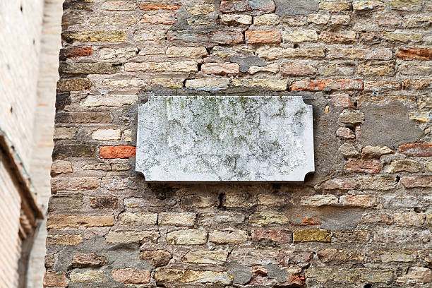istock marble street sign on old brick wall 177873374