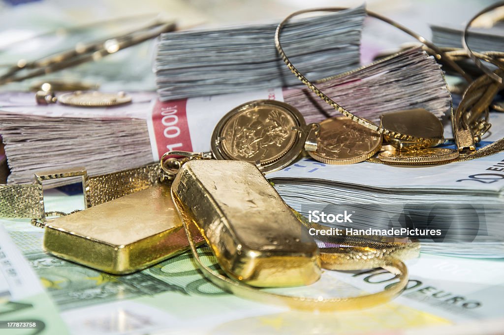 Euro Bills and Gold Euro bills and Gold (bullions and jewellery) Coin Stock Photo