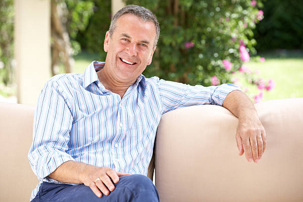 istock Senior Man Relaxing On Sofa At Home 177874372