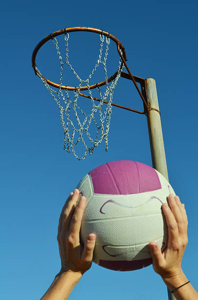 istock Girl Shooting a Netball Goal 177874600