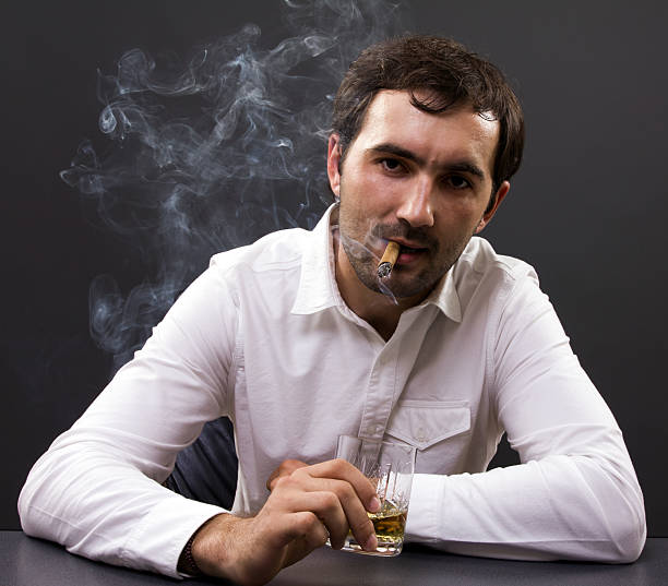 istock Young businessman smoking in his office 177875004