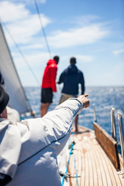 istock Crew members sailing on sailboat on sunny day 1778753024
