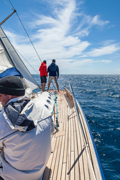 istock Crew members sailing on sailboat on sunny day 1778753560