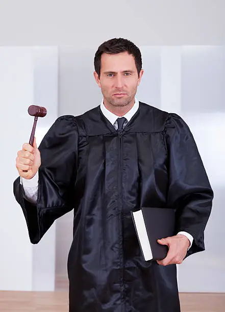 Photo of Portrait Of Serious Male Judge