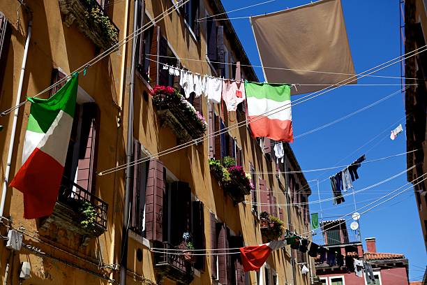 Narrow Street with Washing Lines in Venice, Italy stock photo