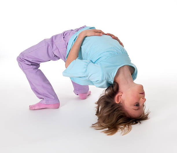 istock little girl showing exercise bridge 177876416