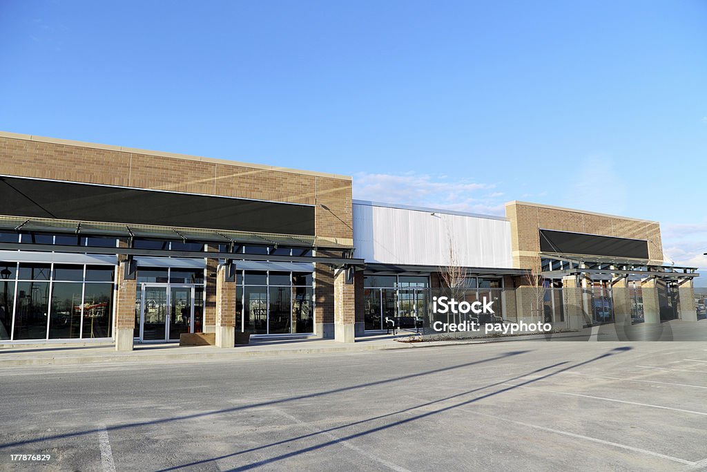 New Commercial Building with Retail and Office Space Available New Commercial Building with Retail and Office Space Available; empty parking space for customer Strip Mall Stock Photo