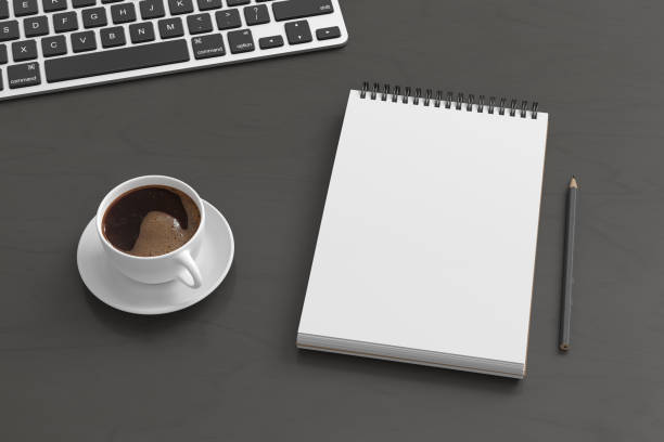 istock Notebook mockup. Blank workplace notebook. Spiral notepad on dark wooden desk 1778768785
