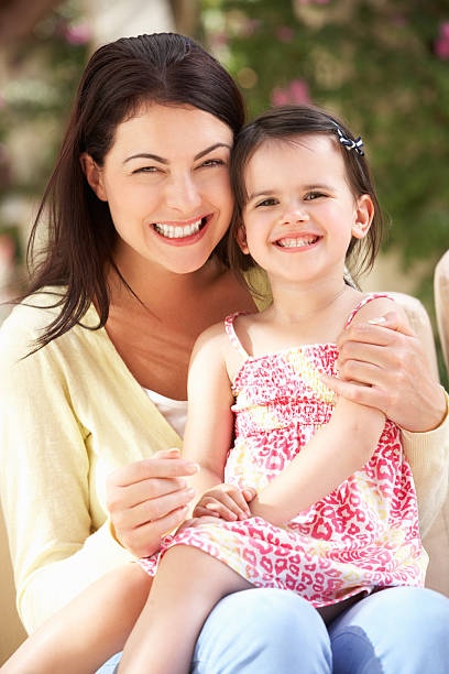 istock Mother And Daughter Relaxing On Sofa Together 177877196