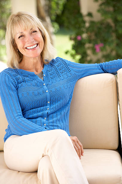 istock Senior Woman Relaxing On Sofa At Home 177877311