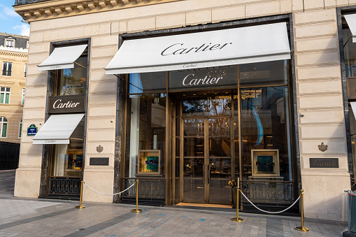 Paris, France - November 6, 2023: Exterior view of the Cartier boutique on Avenue des Champs-Elysées. Cartier is a French company specializing in jewelry, watches and luxury goods