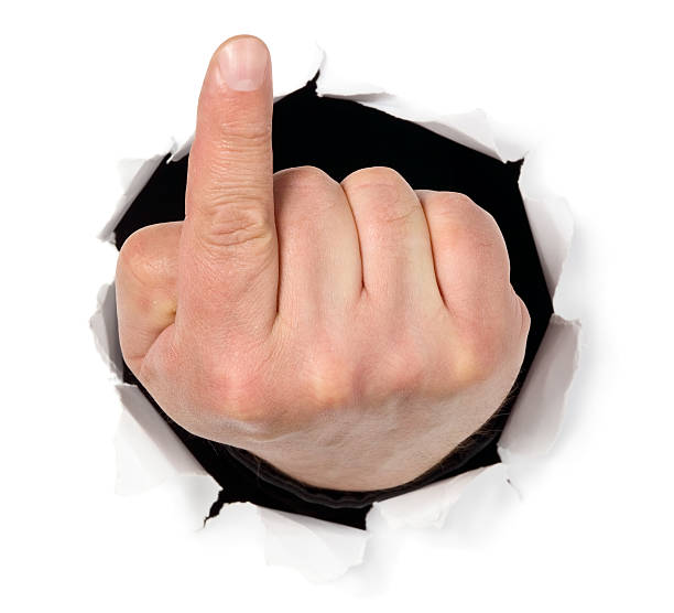 istock Man is showing his fingers through a hole 177877332