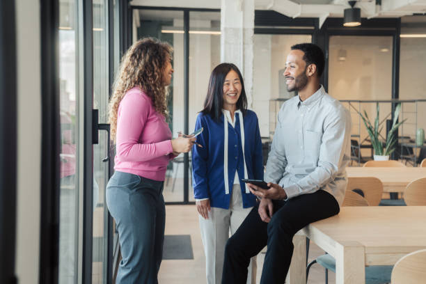 istock Business people standing, smiling and talking together 1778774881