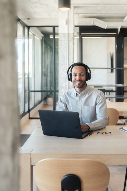 istock Hispanic man working on his laptop 1778776609