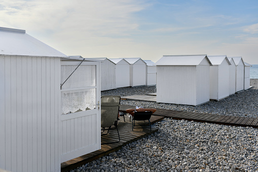 White wooden houses on the ocean coast bathing cabins