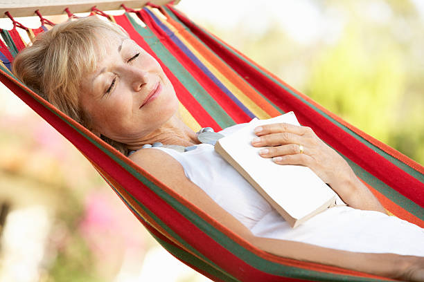 istock Senior Woman Relaxing In Hammock 177879186