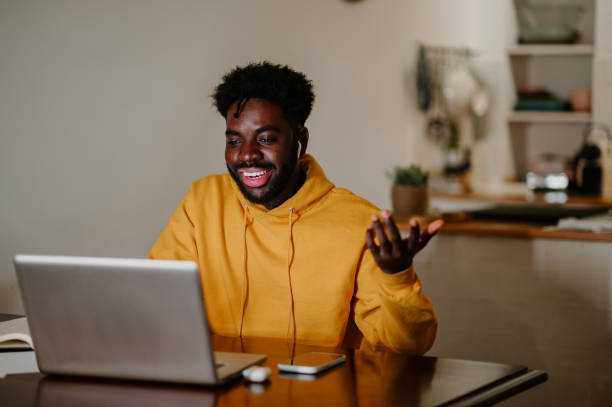 istock A happy casual multicultural freelancer is sitting at home and having a video call with coworkers late at night. 1778795360