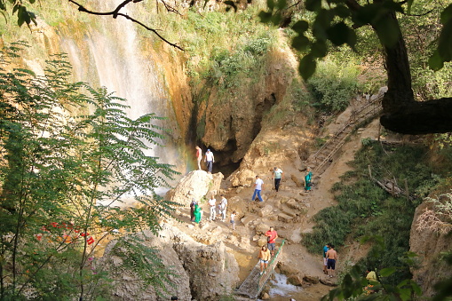 August 21 2023 - Arslanbob, Kyrgyzstan in Central Asia: People at the so-called 'small waterfall' at the top of Arslanbob village, near Jalal-Abad in southern Kyrgyzstan