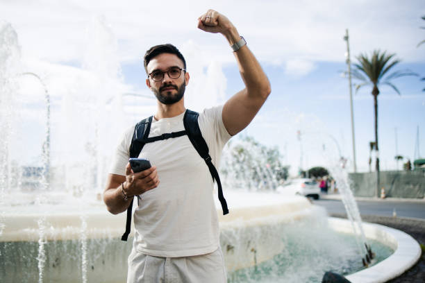 istock Rebellious gay man raising his hand 1778800844