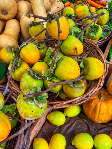 Basket of Hachiya  persimmons at the farmer's market