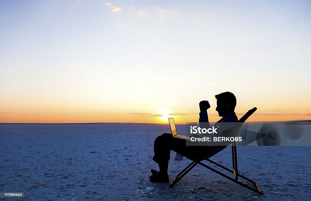 Business success Young businessman enjoying success while checking the sales Achievement Stock Photo