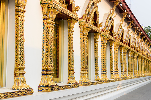 Ornate golden columns around the windows of Wat Chana Songkhram, Bangkok, Thailand