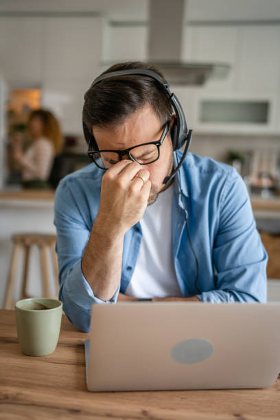 istock Man overworked freelancer at home hold eyes eyestrain pain 1778841304