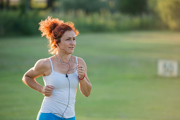 istock girl jogging in nature 177884506