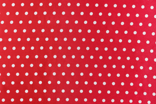 istock texture of red silk or polyester fabric with white polka dots. background for your design 1778853243