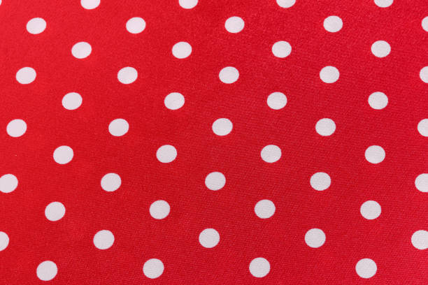 istock texture of red silk or polyester fabric with white polka dots at an angle. background for your design. material for sewing dresses, skirts or shirts 1778854952