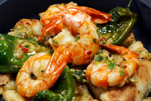 butter and chili garlic saute prawns or shrimps in close up, mediterranean cuisine