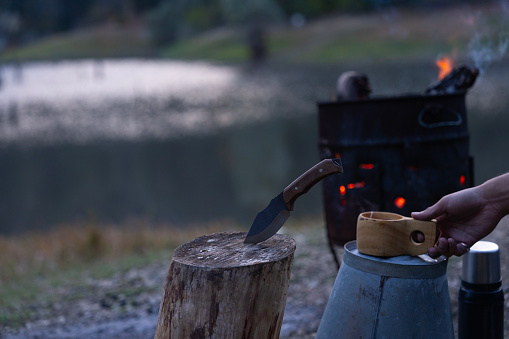 Relaxing with a Wooden Tea Cup in Front of the Campfire Photo, Suluklugol Lake Sakarya- Bolu, Turkey (Turkiye)