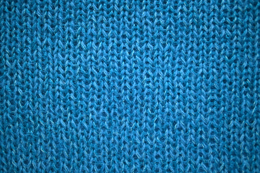 crocheted turquoise woollen fabric fragment
