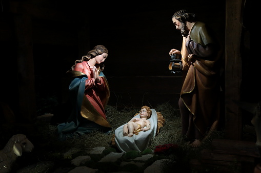 nativity scene with christmas tree background