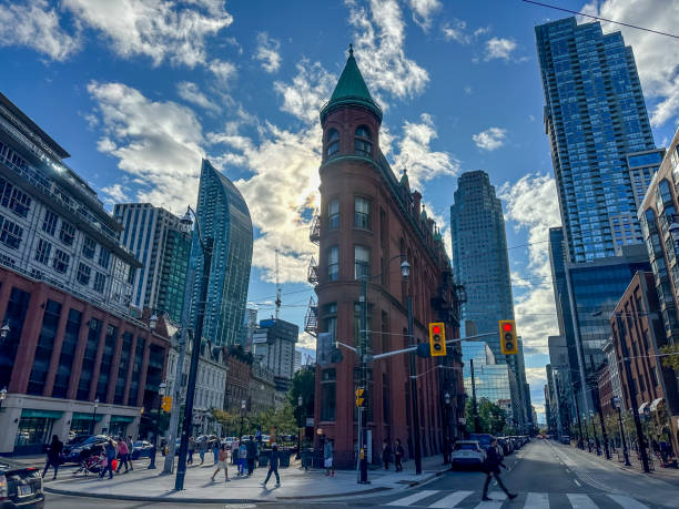 The Gooderham building  against the backdrop of the skyline of downtown Toronto Toronto, Ontario - October 7, 2023: The Gooderham building  against the backdrop of the skyline of downtown Toronto flatiron building toronto stock pictures, royalty-free photos & images