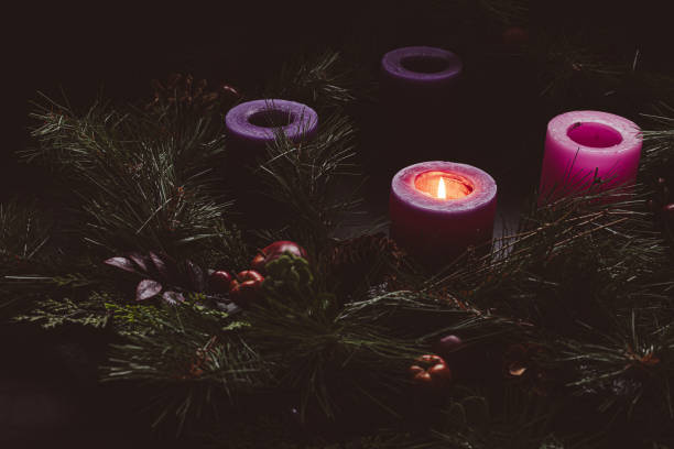 istock Rustic advent wreath with one candle lit in a dark room 1778931550