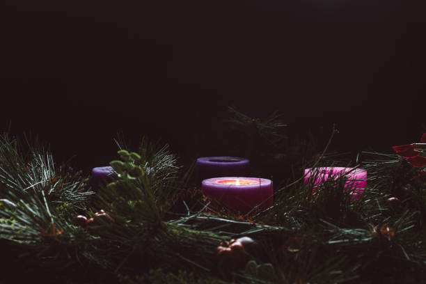 istock Rustic advent wreath with one candle lit in a dark room 1778931559