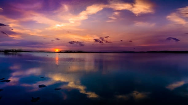 Nature shoot themes: Dramatic morning cloudscape with a reflection on a tropical coastal lagoon.